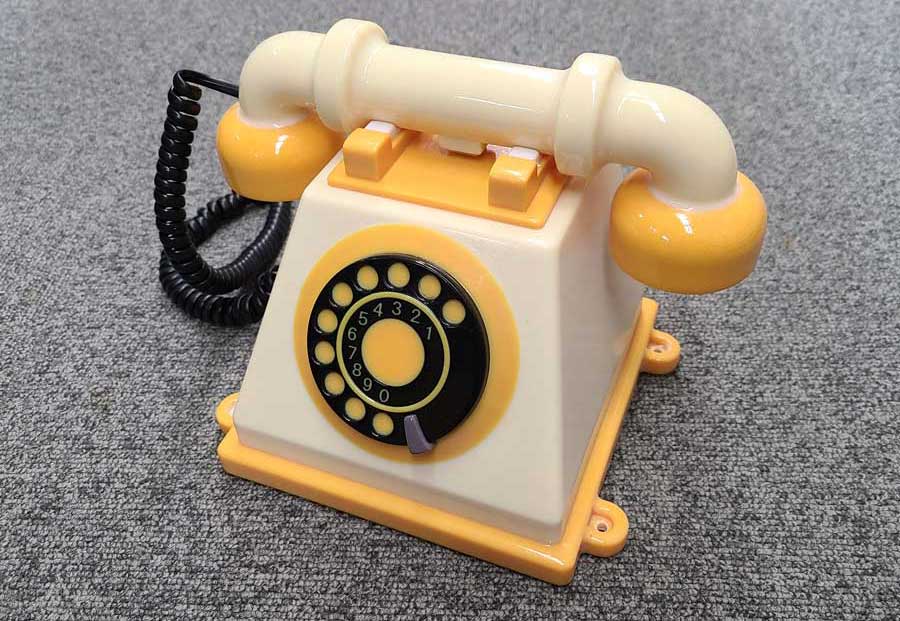 A picture of a colorful, black, yellow, and beige 3D-printed phone
