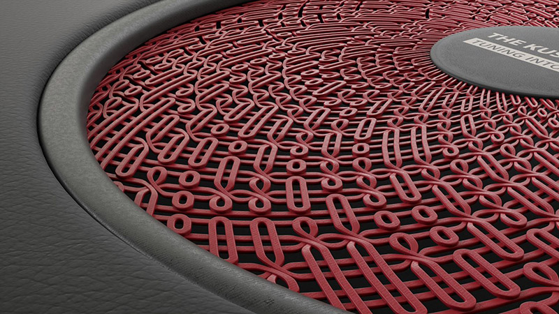 Red car speaker grill design with swirls