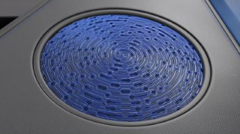 Full view of a blue, wavy car speaker grill 