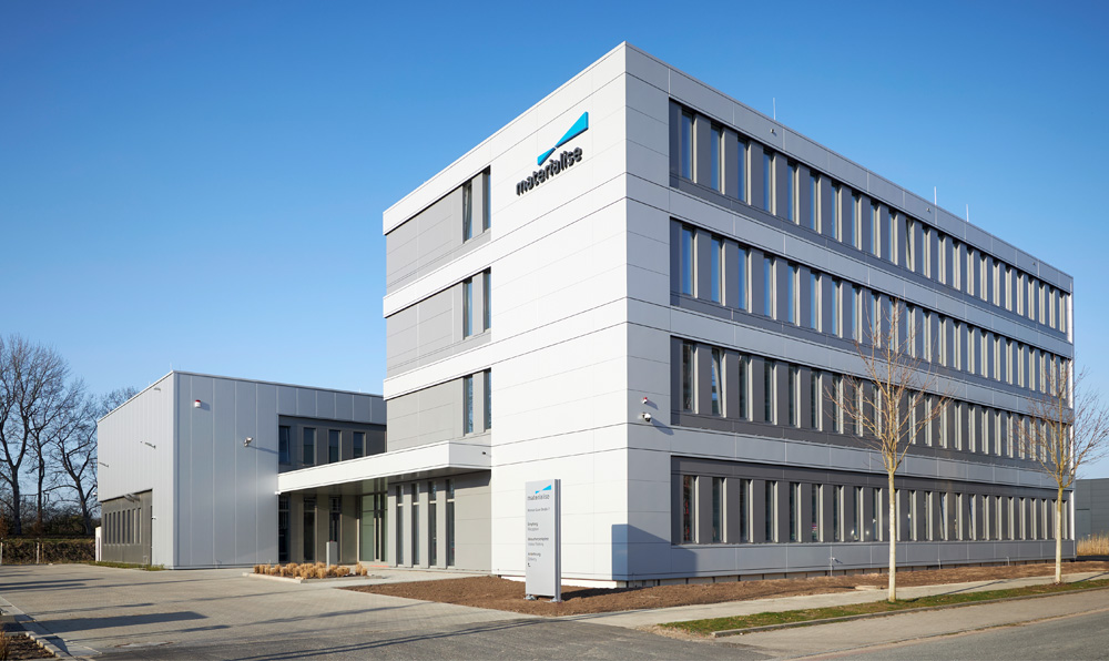 Exterior view of Materialise's Metal Competence Center in Bremen, Germany with a beautiful blue skye