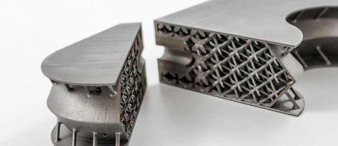 The cross-section of a 3D printed titanium satellite inserts showing the lightweight structures within