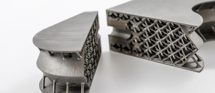 The cross-section of a 3D printed titanium satellite inserts showing the lightweight structures within
