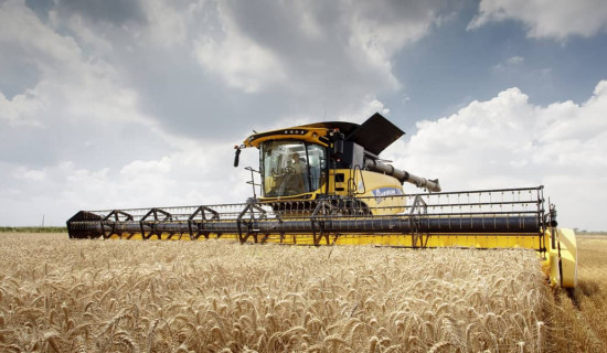 Agricultural machinery by CNH Industrial, pictured at work in a wheat field