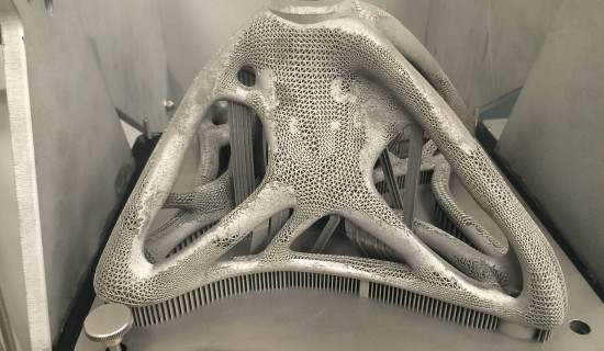 Materialise worked together with Altair and Renishaw to create an R&D spider bracket. The original design was based on brackets that connect the corners of architectural glass panels, used in atriums and floor-to-ceiling wall glazing. The amazing thing about this bracket is that it contains hybrid lattice structures and is successfully 3D printed in Titanium. This design could not have been created with conventional manufacturing methods. The success of the finished part is due to expert application of Alta